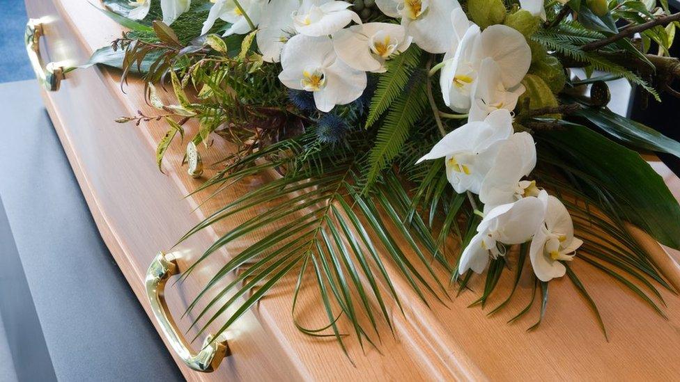 Coffin and flowers