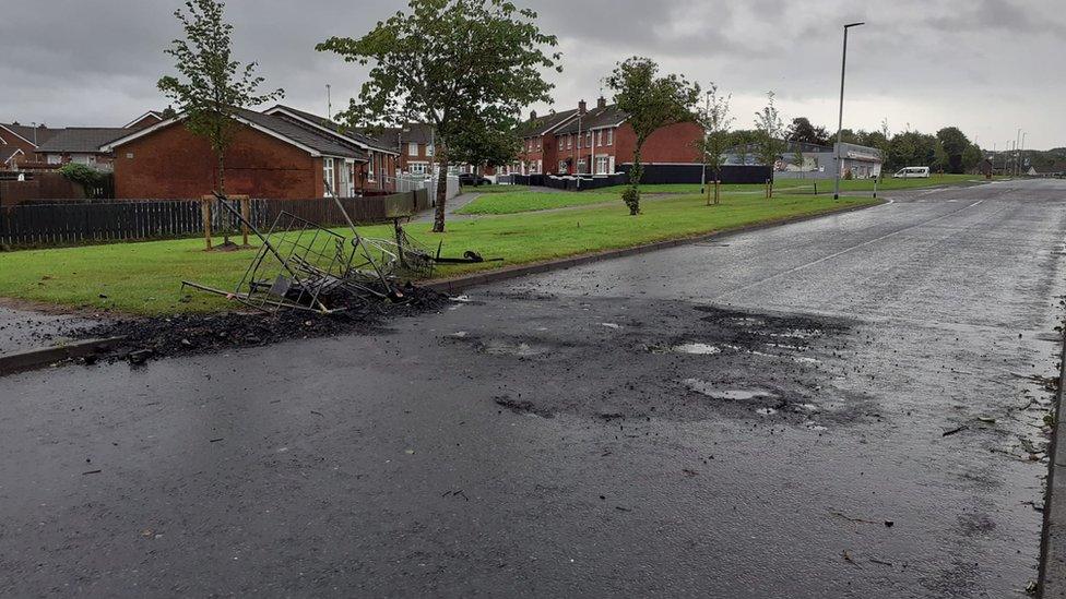 Burnt-out material on road