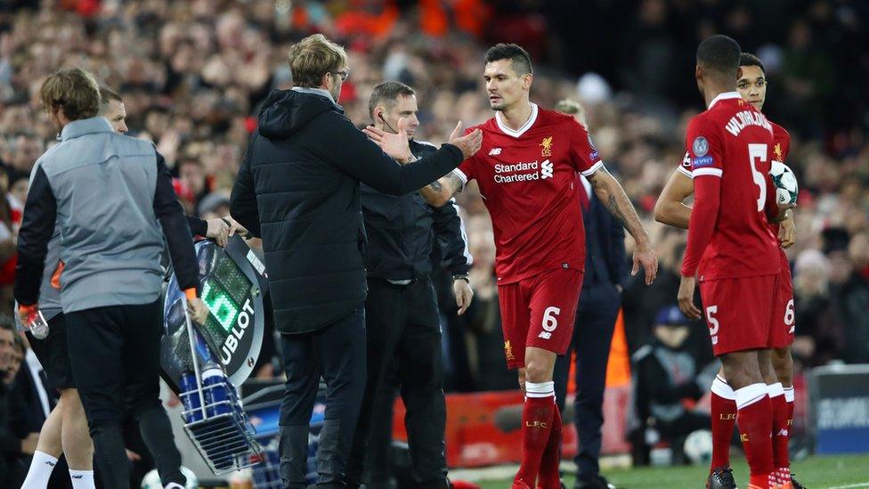 Dejan Lovren of Liverpool shakes hands with Jurgen Klopp, Manager of Liverpool as he is subbed during the UEFA Champions League group E match between Liverpool FC and Spartak Moskva at Anfield on December 6, 2017 in Liverpool, United Kingdom