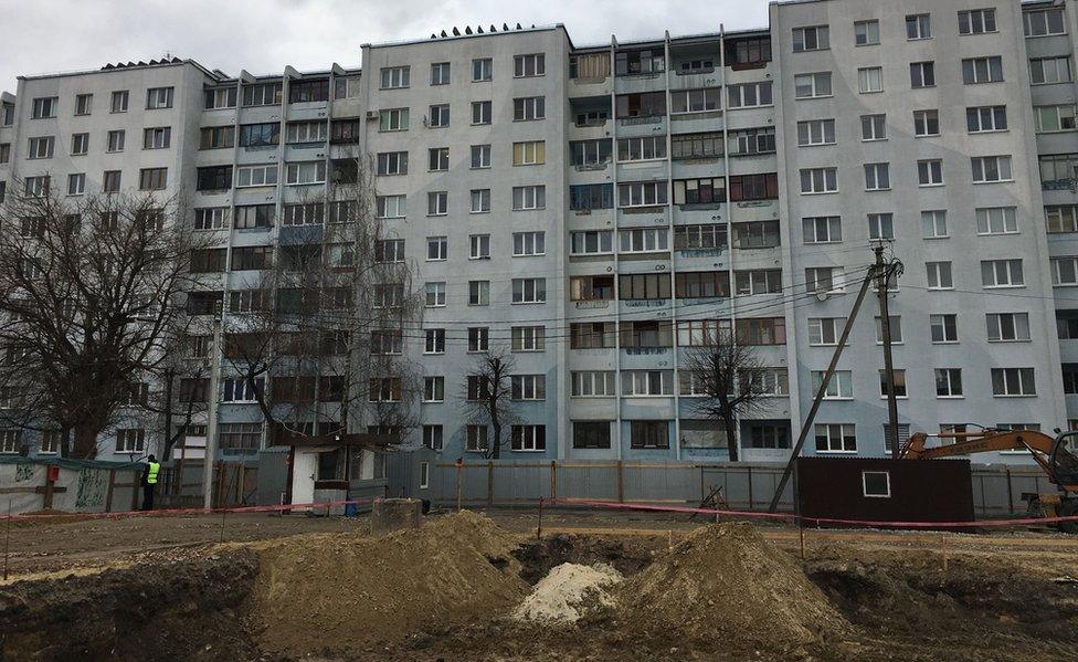 Site of apartment block were mass grave was found