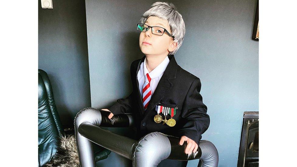 Girl dress as Captain Sir Tom Moore