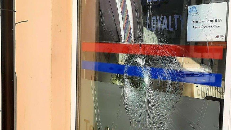 smashed window at constituency office