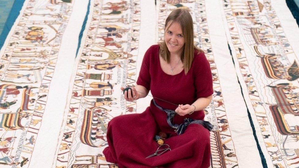 Mia Hansson with her unfinished recreation of the Bayeux Tapestry