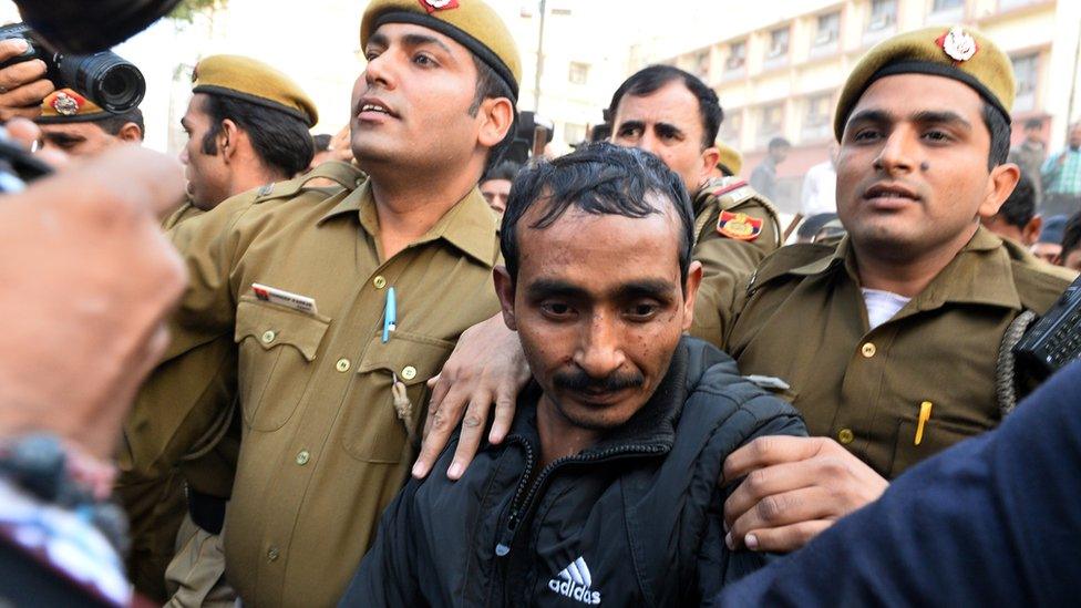 Shiv Kumar Yadav is escorted by police in India following his court appearance in New Delhi, 8 December 2014