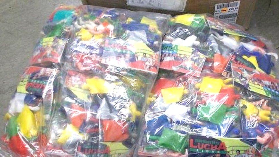 The packages of toy figures with crystal meth hidden inside