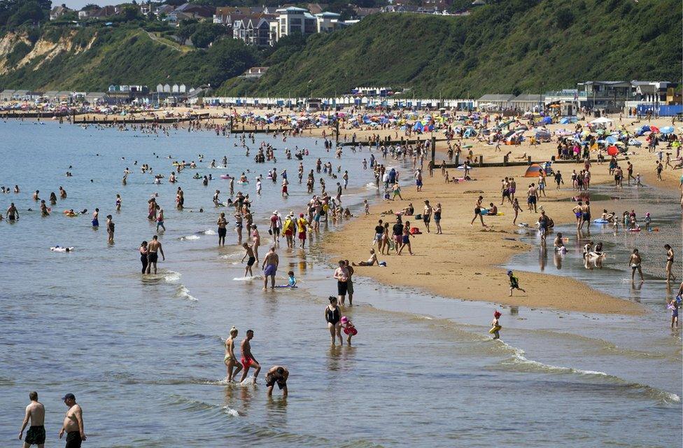 People enjoy the weather on Bournemouth beach in Dorset on Monday