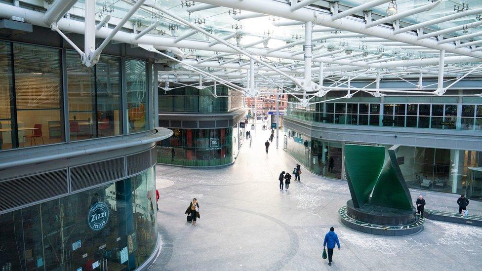 People walk through a largely empty shopping centre in Victoria