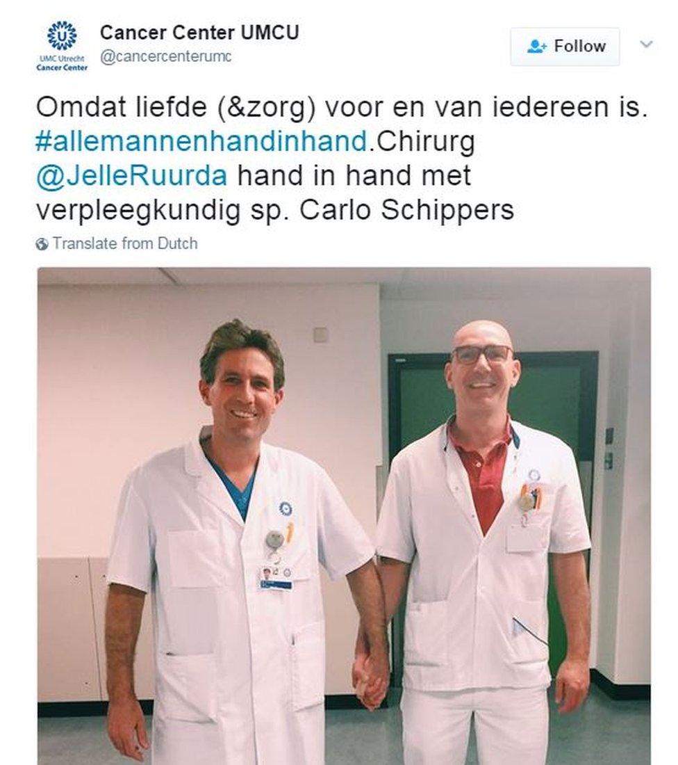 Two medical staff hold hands at an Utrecht hospital: "Because love (and care) is for everyone"