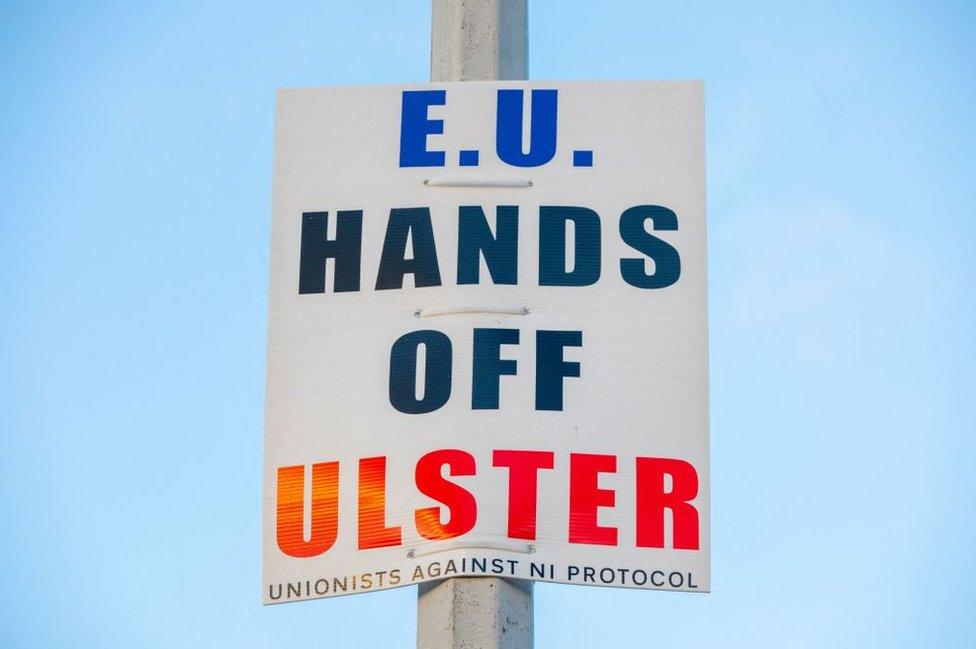 A sign that reads: EU HANDS OF ULSTER - UNIONISTS AGAINST NI PROTOCOL