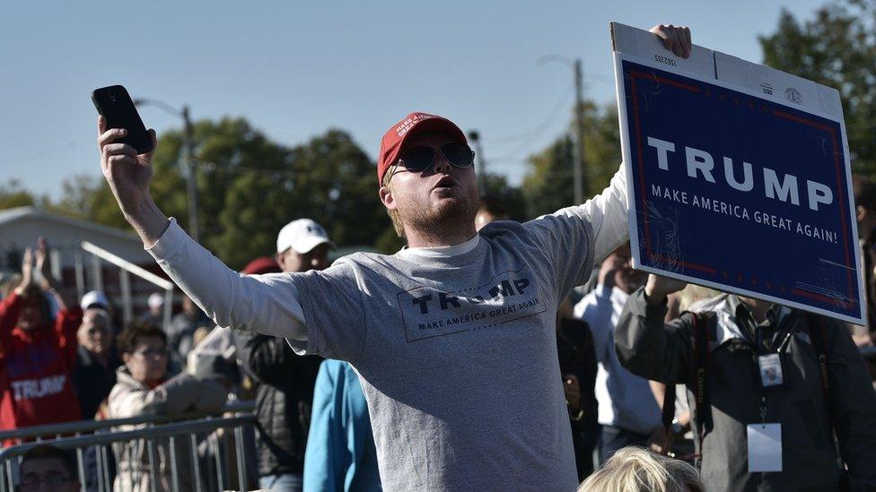 A supporter of Republican presidential nominee Donald Trump chants his name at the Walworth County Fairgrounds in Elkhorn, Wisconsin, 8 October