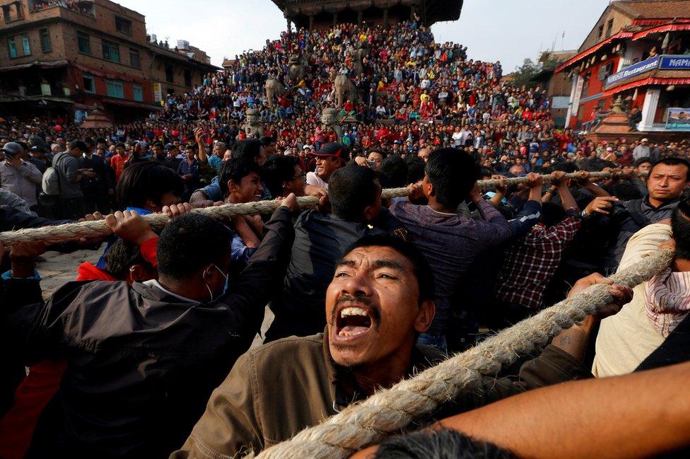 Devotees pull the chariot of the god Bhairab during the Biska Festival.