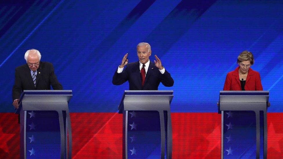 Mr Sanders, Mr Biden and Ms Warren on stage at the Houston debate in September