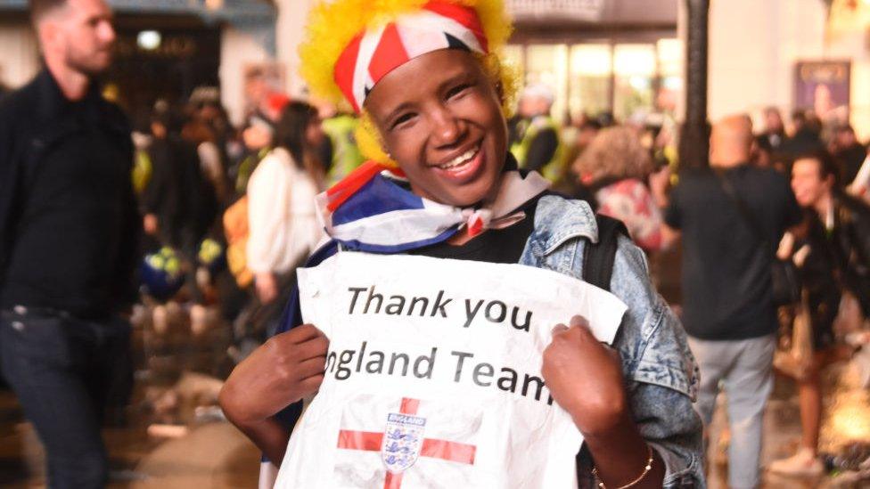 Fan hold up thank you message to England team