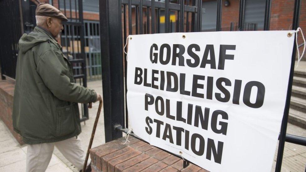 Voter enters polling station in Cardiff