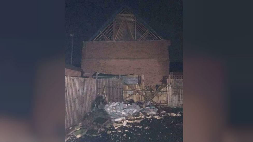 Bricks and rubble fell into local residents garden