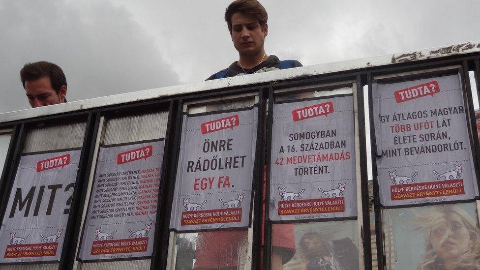 A selection of Two-Tailed Dog Party posters in Blaha Lujza Square, Budapest