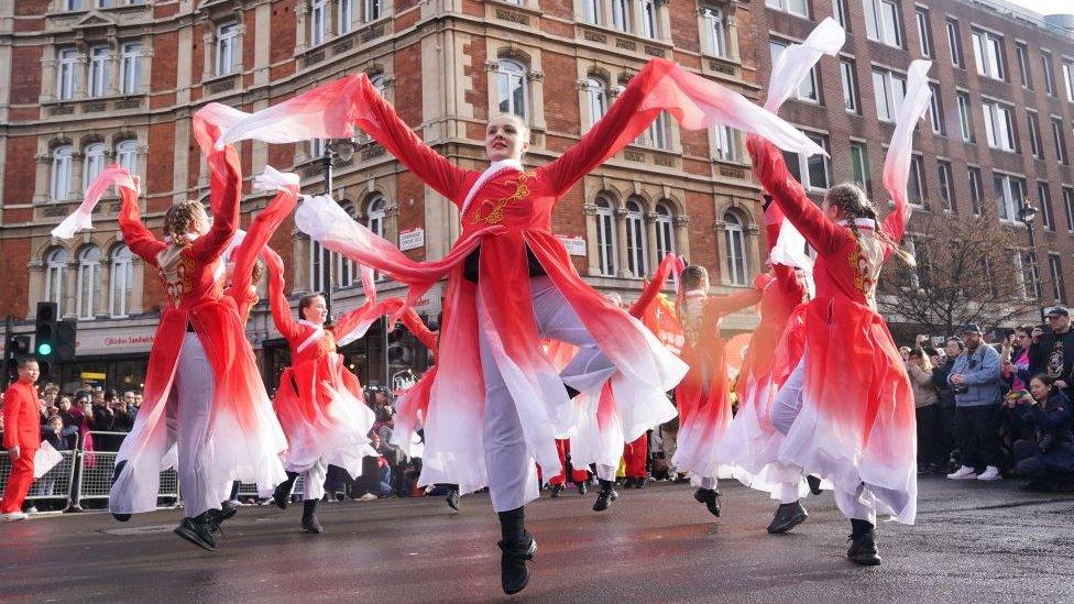 Performers take part in a parade involving costumes, lion dances and floats, to mark Lunar New Year, also known as the Spring Festival or Chinese New Year, in London.