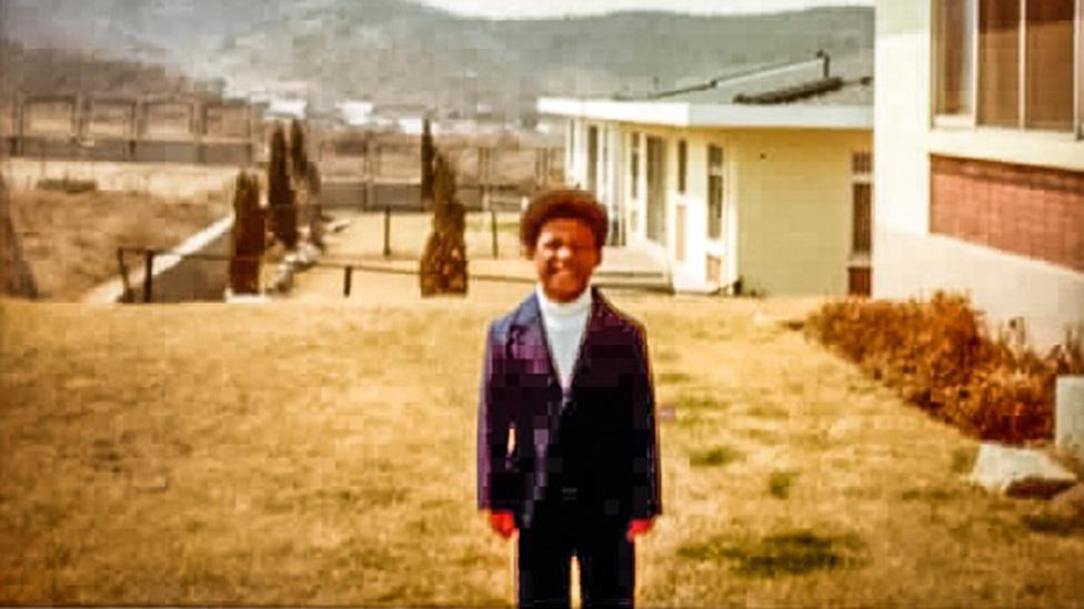 Milton pictured at a US military housing complex in South Korea, soon after he was adopted