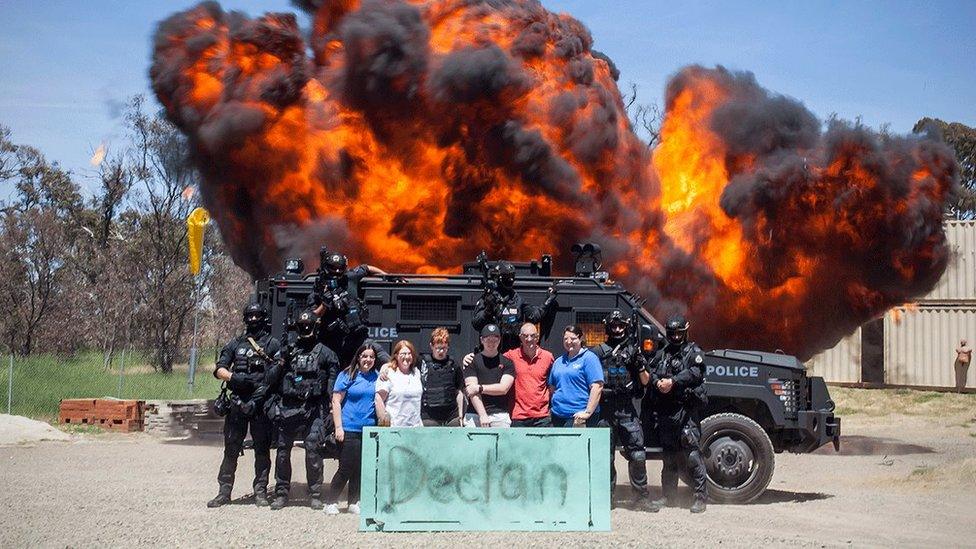 Australian Police pose for a photo with leukaemia patient Declan and his family