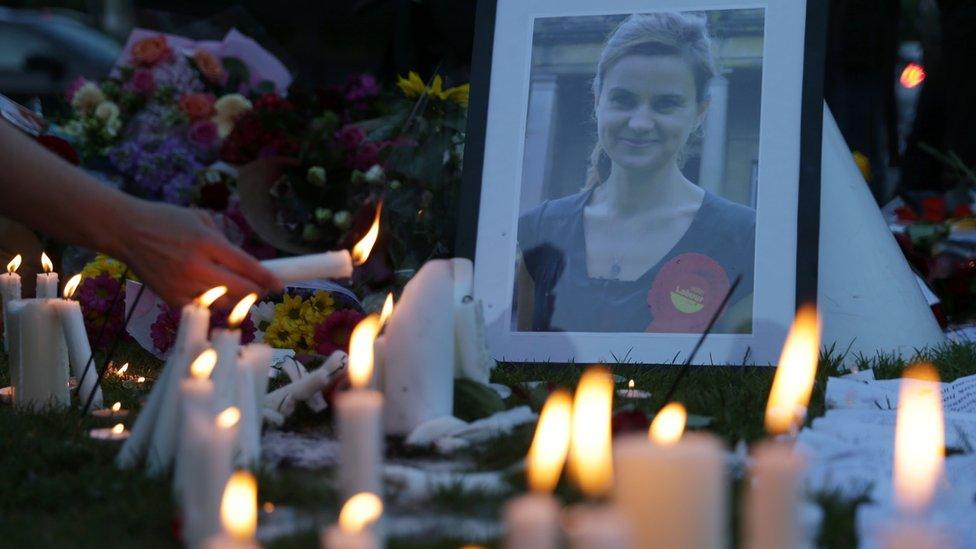 People light candles at the tribute in Parliament Square on 17 June 2016 in remembrance of Labour MP Jo Cox