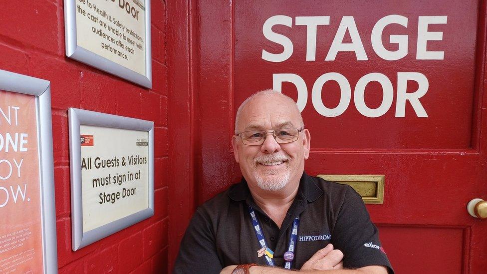 Tony Bell standing outside of the Stage Door