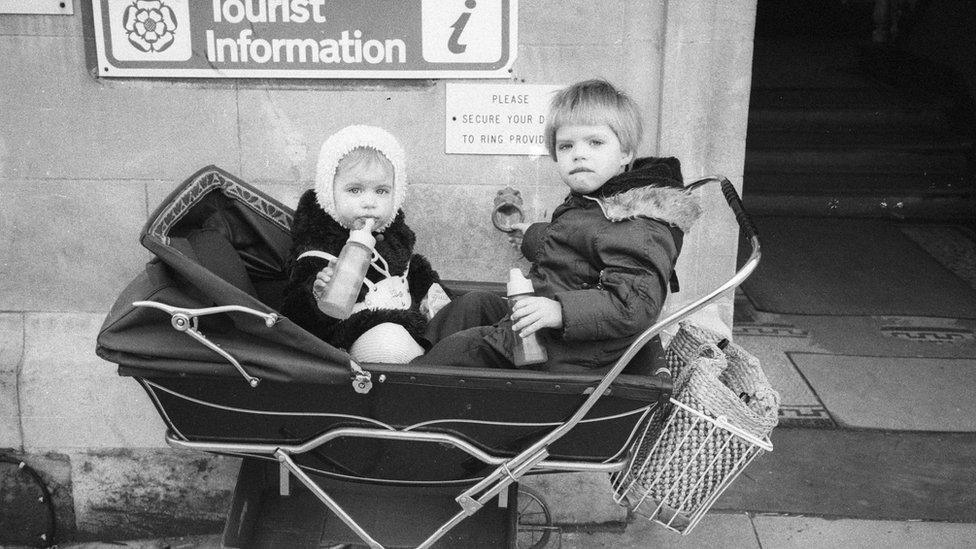 Two children in a pram