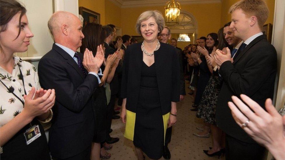 Mrs May welcomed by staff inside Number 10