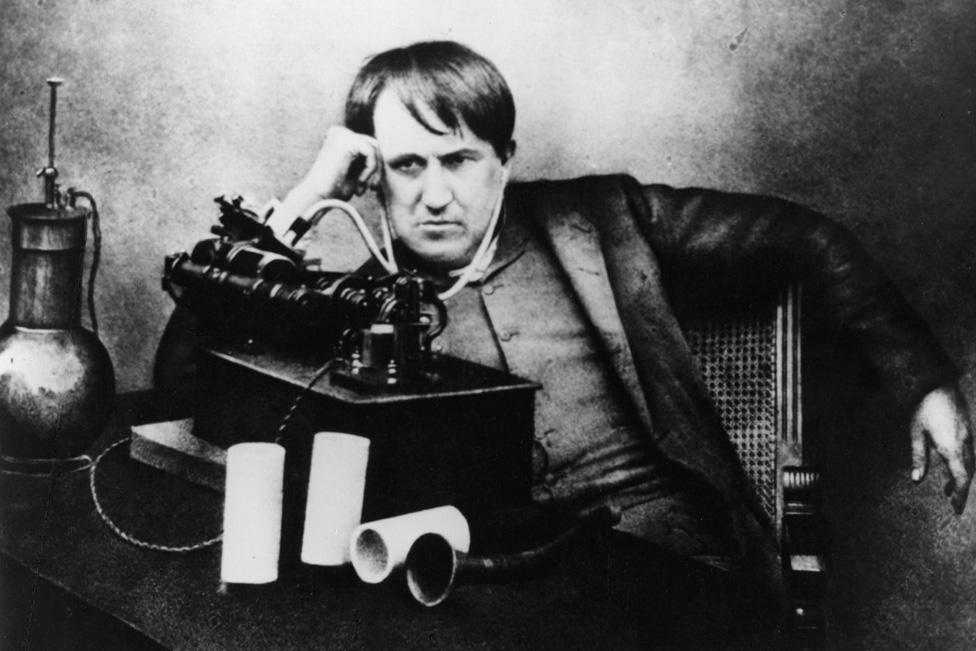 Thomas Alva Edison (1847 - 1931) American scientist, inventor and industrialist, after spending 5 continuous days and nights perfecting the phonograph, listening through a primitive headphone.