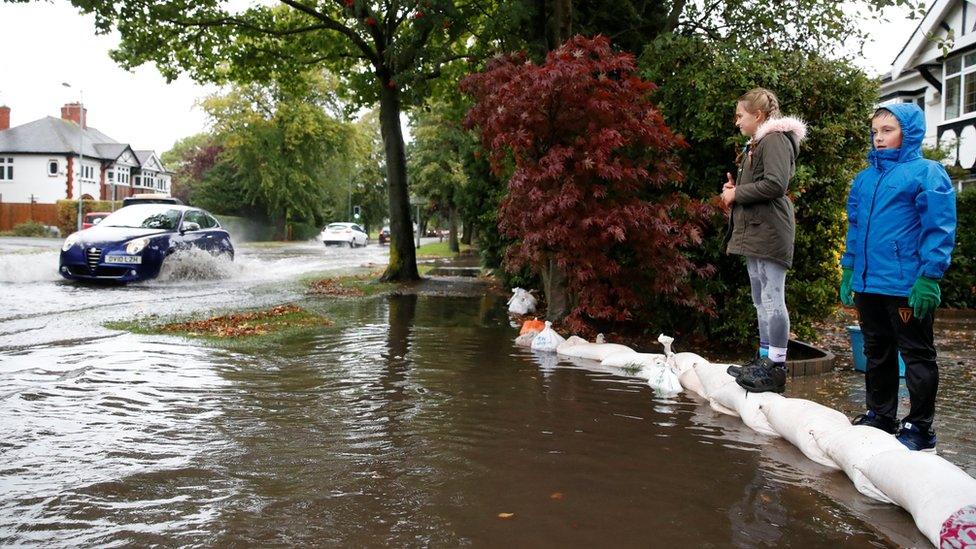 Residents sand bag their houses as flooding hits Newcastle-under-Lyme, Staffordshire