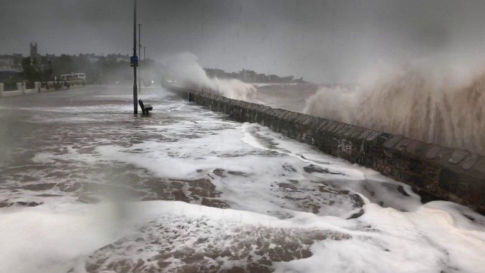 wave hitting seafront