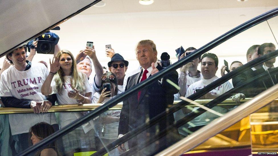 Donald Trump makes his entrance via a golden escalator