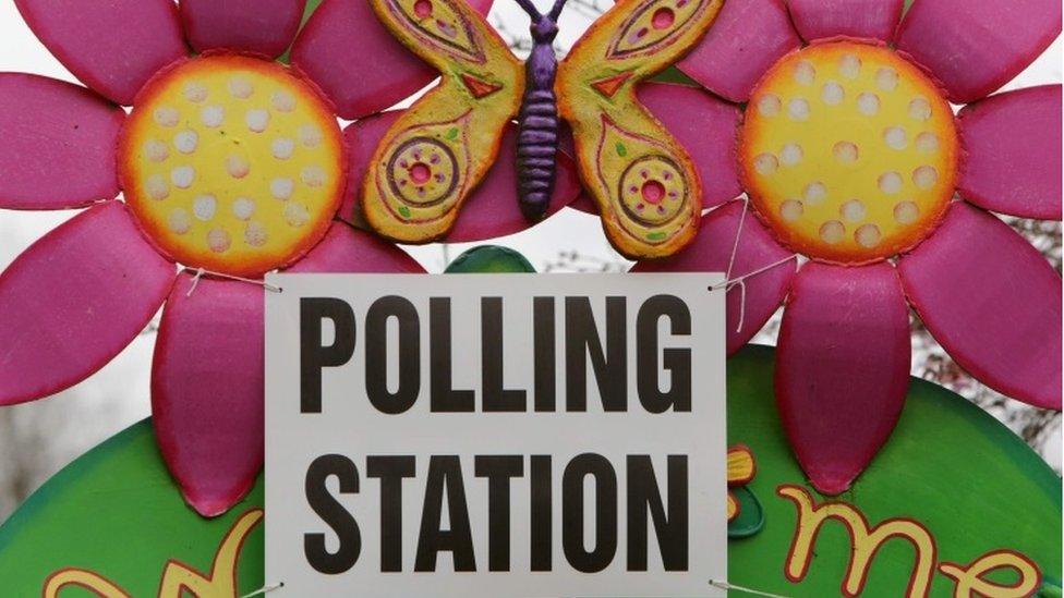 A sign indicates a polling station set up at a school in Castlederg, County Tyrone