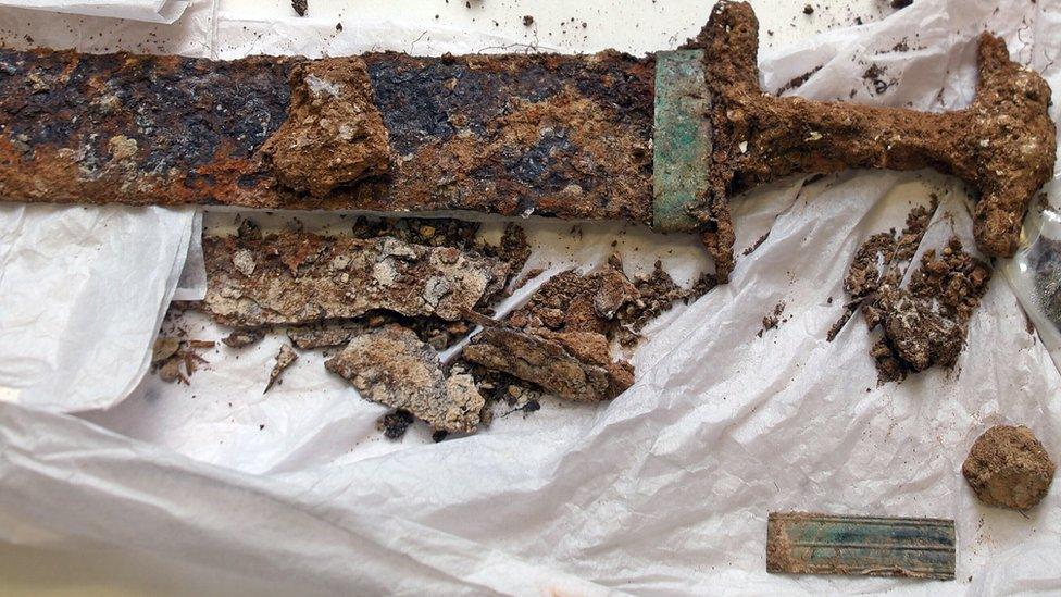 The sword and scabbard found in the burial