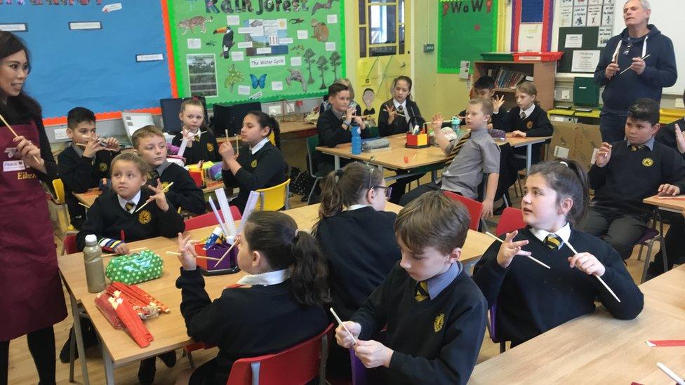 Pupils at Hart Memorial Primary School learning about chopsticks