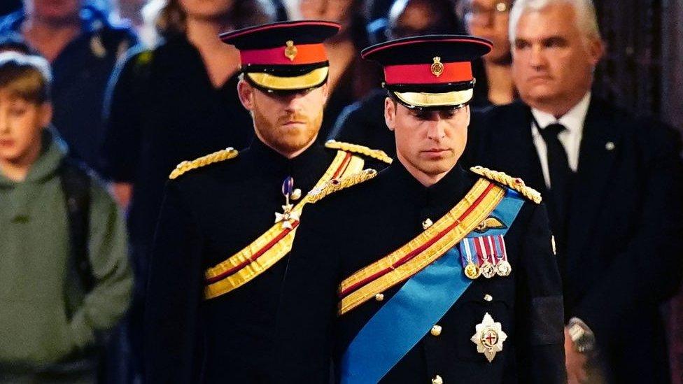 Prince William and Prince Harry, in military uniform.