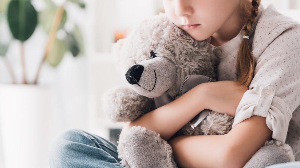 Girl with teddy bear