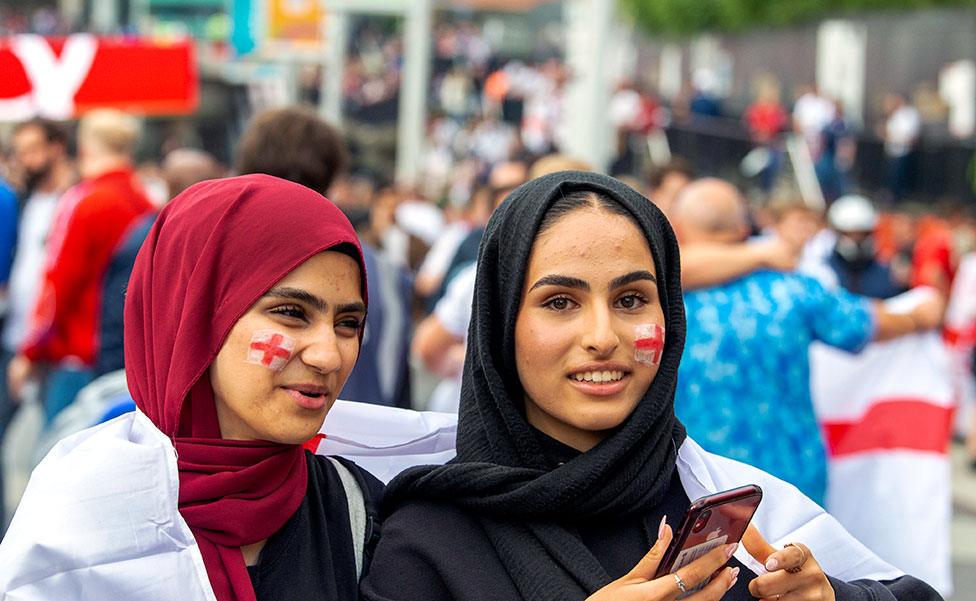 Two England fans seen outside Wembley Stadium ahead of the England v Denmark UEFA Euro 2020 semi-final