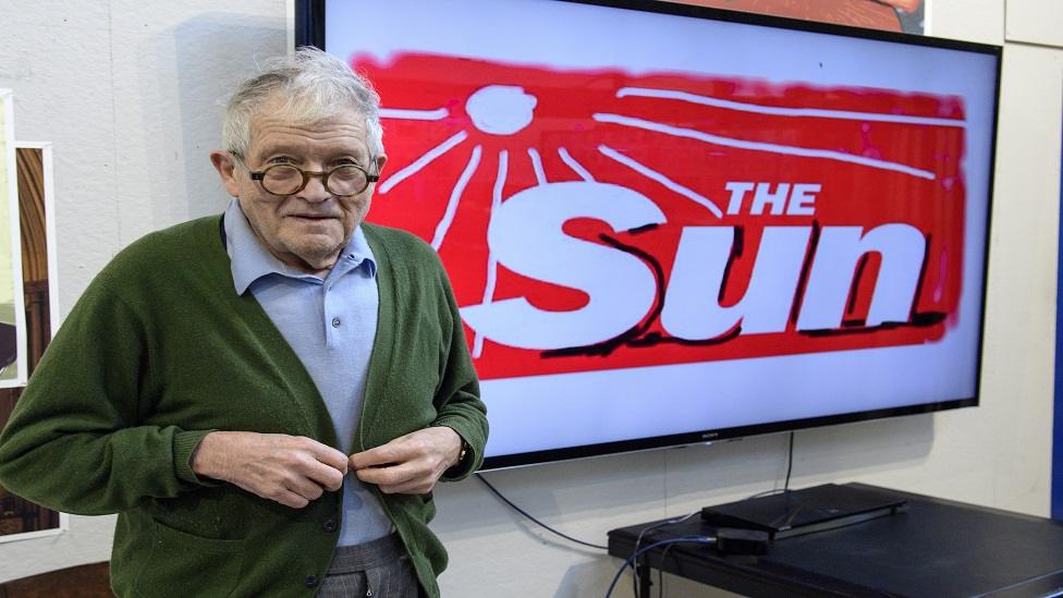 David Hockney with his Sun logo