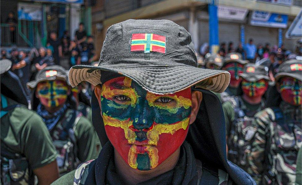 CHURACHANDPUR, MANIPUR, INDIA - 2023/06/23: A tribal student painted with the flag of the Zami tribe takes part in the silent march in memory of all the tribal people who lost their lives in the ethnic clashes in Manipur.