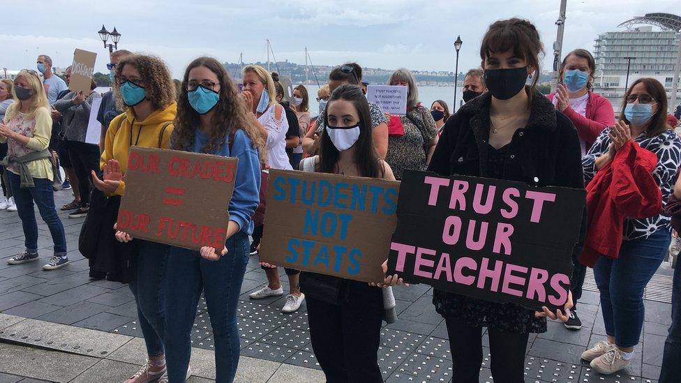 Students holding placards