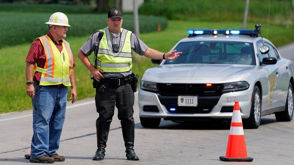 Police block traffic near the crime scene