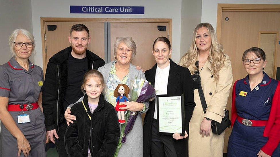 Brogan Williams's family with her award