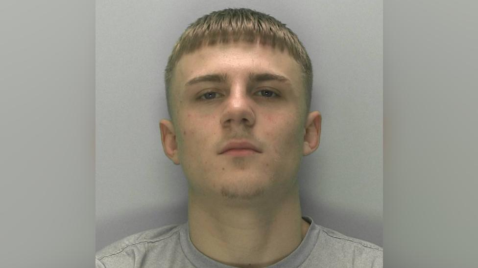 Police shot of jailed man Elliott Fitts-Hawkins with blurred lines around the side of image