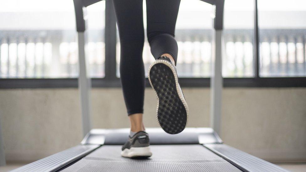 Women legs on treadmill at gym (stock photo)