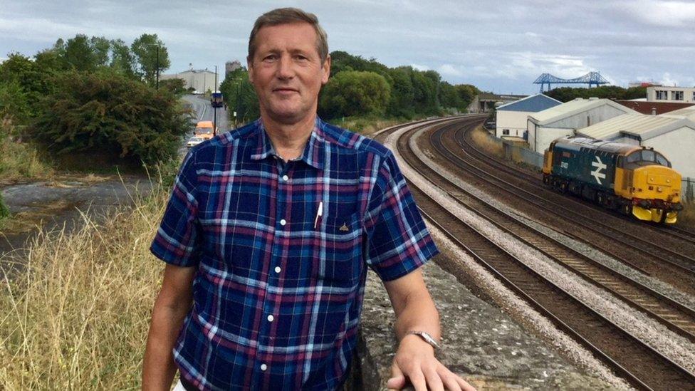 Craig at the road next to the railway line