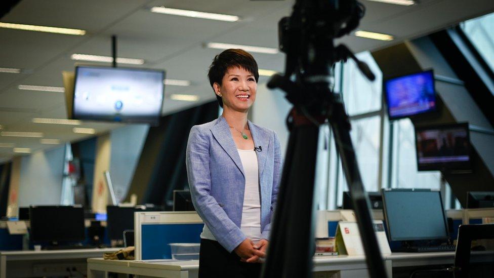 China Global Television anchor Liu Xin - stands in front of camera