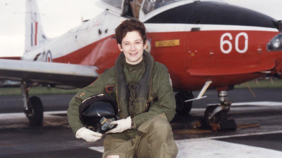 Julie in front of a plane