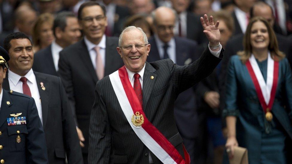 Peru's President Pedro Pablo Kuczynski waves to crowds after being sworn-in