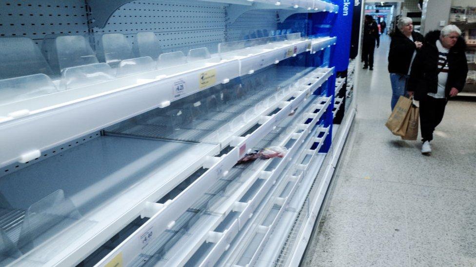 Empty shelves in a Sainsbury's supermarket in London in March 2020