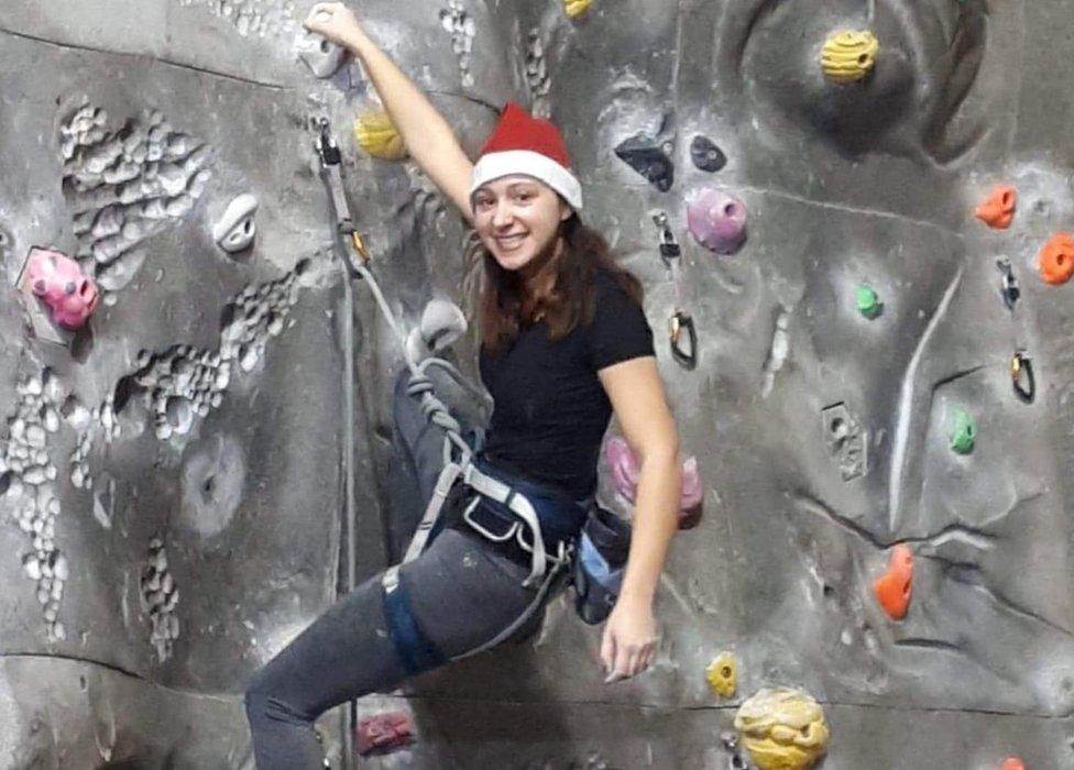 Ffion Diaz at an indoor climbing wall in Gloucester